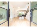 Elegant foyer showcasing beautiful hardwood floors and an open layout leading to the living spaces at 3338 Breton Ne Cir, Brookhaven, GA 30319