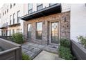 Charming front entrance features brick accents, a stylish door, and attractive landscaping at 852 Constellation Dr, Decatur, GA 30033