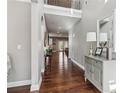 Bright foyer with hardwood floors, high ceilings, and a view into the living spaces at 5365 Vendelay Ln, Cumming, GA 30040