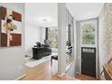 Bright home office with hardwood floors, exposed brick, and large windows at 1323 Peachtree Ne Vw, Atlanta, GA 30319