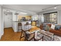 Inviting living room open to kitchen featuring bar seating and modern decor at 300 Peachtree St # 23-A, Atlanta, GA 30308