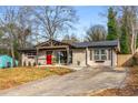 Inviting single-story home with a red front door and a long driveway at 3430 Pinehill Dr, Decatur, GA 30032