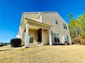 Inviting townhome with covered entry and neutral siding, set on a well-kept lawn at 5070 Oakley Commons Blvd, Union City, GA 30291