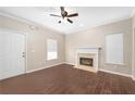 Open-concept living room with fireplace, tile flooring, and natural light at 1477 Akridge Nw St, Atlanta, GA 30314