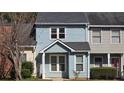 Inviting townhouse showcasing a covered entrance and charming curb appeal at 2173 Wellington Cir, Lithonia, GA 30058