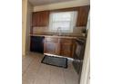 Well-lit kitchen featuring ample cabinet space and modern black appliances at 2173 Wellington Cir, Lithonia, GA 30058
