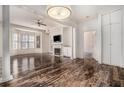 Bright living room featuring hardwood floors, fireplace, large windows, and open layout at 850 Piedmont Ne Ave # 1302, Atlanta, GA 30308