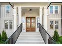 Close up of the front entrance of a home, showcasing a charming staircase and an inviting entryway at 993 Northrope Ne Dr, Atlanta, GA 30324