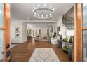 Bright and airy living room featuring hardwood floors, modern decor, and an open layout with views to the kitchen at 993 Northrope Ne Dr, Atlanta, GA 30324