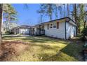 This home has a brick exterior, complemented by lush greenery at 3331 Casa Linda Dr, Decatur, GA 30032