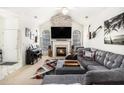Cozy living room with vaulted ceilings, fireplace, ample seating, and stylish decor at 4809 Shae Ct, Powder Springs, GA 30127