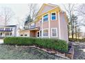 Charming two-story home with attached garage and privacy hedge for a secluded view at 4852 Gold Nugget Way, Sugar Hill, GA 30518
