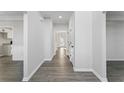 Bright hallway with new floors, fresh paint, and elegant trim details throughout the home at 4275 Azalea Walk, Ellenwood, GA 30294