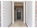 Front door view with white columns, brick, and black front door with glass at 5316 Radford Loop, Fairburn, GA 30213