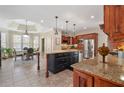 Bright and airy kitchen with granite counters, stainless appliances, large island with seating, and dining area with bay window at 644 Herring Rd, Grayson, GA 30017