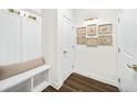 Well-organized mudroom with a built-in bench, coat hooks, and stylish decor at 2917 Knob Creek Dr, Snellville, GA 30078