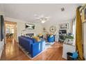 Inviting living room featuring hardwood floors, fireplace, ceiling fan, and stylish decor at 6105 Queen Anne Ct, Norcross, GA 30093