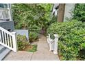 Landscaped walkway leading to the home, surrounded by greenery at 31 Greenland Trce, Atlanta, GA 30342