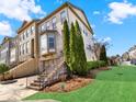 Side yard with manicured landscaping, brick stairs, and well-maintained shrubbery at 2124 Silas Nw Way, Atlanta, GA 30318