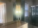 Bathroom featuring a large vanity, mirrored cabinet, and shower-tub combo with glass doors at 294 Hascall Nw Rd, Atlanta, GA 30309