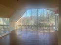 Spacious living room with hardwood floors and large windows offering abundant natural light at 294 Hascall Nw Rd, Atlanta, GA 30309