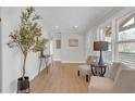Inviting entryway with light wood floors, stylish furniture, and bright natural light at 3235 Bluebird Ln, Decatur, GA 30032