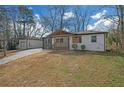 Attractive single-Gathering home featuring a freshly painted exterior and manicured lawn at 3235 Bluebird Ln, Decatur, GA 30032