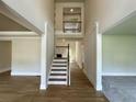Stunning two-story foyer with hardwood floors, staircase, and an open view to the second floor at 218 Lotus Ln, Covington, GA 30016