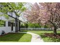 Landscaped front yard featuring a walkway, flowering trees, and green grass leading to the home's entrance at 270 Piedmont Ne Rd, Marietta, GA 30066