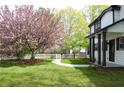 View of the home's front yard with a green lawn, walkway, and a flowering tree, with a partial view of the house at 270 Piedmont Ne Rd, Marietta, GA 30066