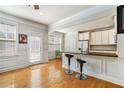 Kitchen bar with black countertops, stainless steel appliances and light colored cabinetry at 2402 Palladian Manor Se Way # 3, Atlanta, GA 30339