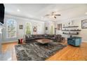 Bright living room with hardwood floors, ceiling fan and comfortable seating with decor at 2402 Palladian Manor Se Way # 3, Atlanta, GA 30339