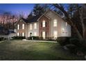 Charming two-story home featuring a brick and stucco facade, well-maintained landscaping, and a welcoming front entrance at 3920 Vine Gate Dr, Lithonia, GA 30038