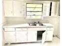 Well-lit kitchen with stainless steel sink, plenty of storage and lots of natural light at 2075 Dellwood Pl, Decatur, GA 30032
