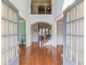 Spacious foyer with hardwood floors, high ceilings, and a view of the staircase leading to the upper level at 5732 Ashleigh Walk Dr, Suwanee, GA 30024