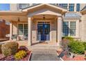 Inviting front porch with brick facade, double doors, and ample space for seating, enhancing curb appeal at 5732 Ashleigh Walk Dr, Suwanee, GA 30024