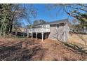 Backyard exterior view featuring a spacious wooden deck, perfect for outdoor entertaining at 600 Canterbury Ln, Lawrenceville, GA 30046