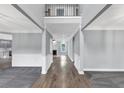 Spacious foyer showcasing an open floor plan, hardwood flooring, and a glimpse of the living area at 2784 Hilson Commons, Decatur, GA 30034