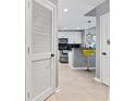 Hallway view leading into the kitchen area showcasing modern design and ample lighting at 250 Pharr Ne Rd # 1702, Atlanta, GA 30305
