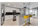 Modern kitchen featuring stainless steel appliances, breakfast bar, and an open layout at 250 Pharr Ne Rd # 1702, Atlanta, GA 30305