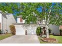 This suburban home features a two-car garage, brick accents, and mature shade trees in a well-maintained neighborhood at 3258 Welmingham Sw Dr, Atlanta, GA 30331