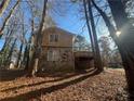 Exterior angle view showing a stone facade on the lower level of the home at 4820 Banner Elk Dr, Stone Mountain, GA 30083