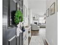 Inviting foyer featuring gray walls, dark wood floors, and view to the open living space with abundant natural light at 129 Swanee Ln, Woodstock, GA 30188