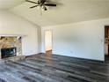 Open living room with stone fireplace and hardwood floors, great for entertaining at 3170 Ashly Brooke Dr, Snellville, GA 30078