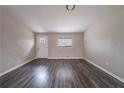 Bright living room featuring wood-look floors, neutral walls, and natural light from the window at 3680 Brookcrest Cir, Decatur, GA 30032