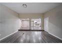 Open-concept living space with hardwood floors, seamlessly connecting to a modern kitchen at 3680 Brookcrest Cir, Decatur, GA 30032