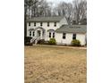 Two-story home with mature landscaping and large lot at 4424 Lower Fayetteville Rd, Sharpsburg, GA 30277