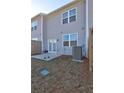 Backyard view with gray siding and patio at 534 Magnolia Cir, Palmetto, GA 30268