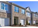 Beautiful brick townhome with a one-car garage and well-maintained landscaping at 534 Magnolia Cir, Palmetto, GA 30268