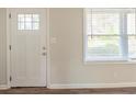 Bright entryway showcasing a white door, fresh paint and wood-look flooring at 1624 Linda Dr, Decatur, GA 30032